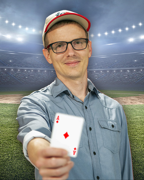 Jordan kern holding a ace card in front of a stadium.